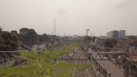 Train Passing  at Jatinegara Railways Interchange Stock Footage 113593922