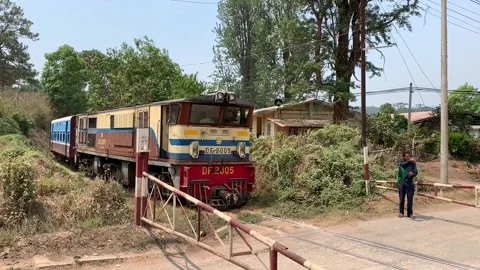Train Passing A Level Crossing Towards Kalaw Station, Kalaw, Myanmar Stock Footage 220672059