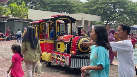 Train passing at local swimming pool with passenger on it Stock-Footage 255696045