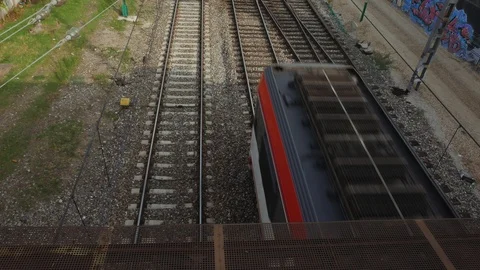 Train passing by in madrid under a bridge in Madrid Video stock 116318412