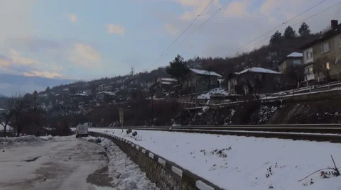 Train passing by a mountain village Stock Footage 59102406