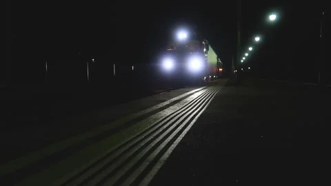 Train passing at night in a Romanian train station Stock Footage 152556178
