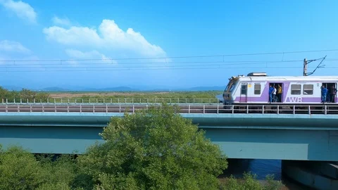 Train passing over a beautiful bridge Stock Footage 122916413