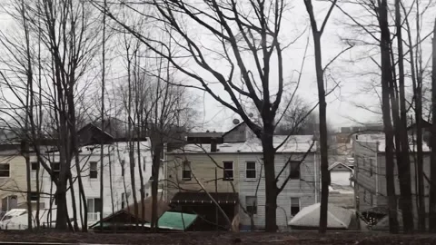 Train passing over a cold and mysterious town Stock Footage 136203208