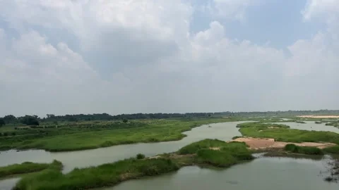 The train is passing over a dry river Stock Footage 313456093