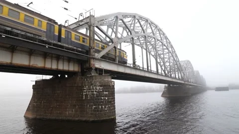 Train passing over "Dzelzceļa tilts" Railway Bridge 스톡 동영상 172273330