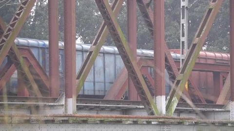 Train passing over river on railway track 動画素材 202347621