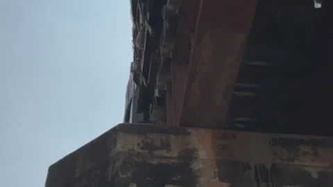 Train Passing Over Rusted Railway Bridge Video stock 322753775