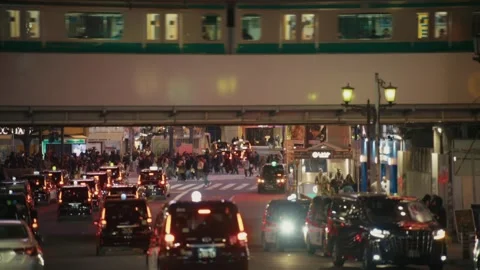 Train Passing Over Shibuya Crossing at Dusk, Tokyo Stock Footage 340865686