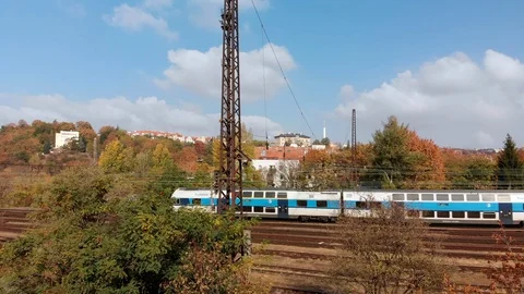 A train passing by over the train tracks in Prague Stock Footage 116009030