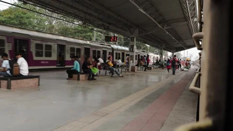 Train passing on platform Stock Footage 241242362