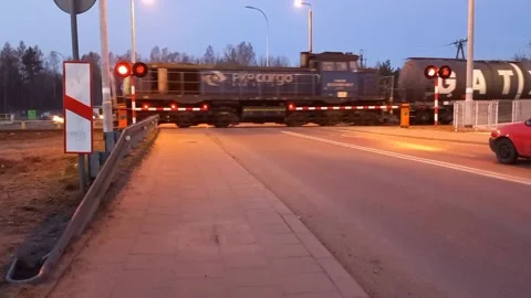 Train passing a railroad crossing Stock-Footage 179876567