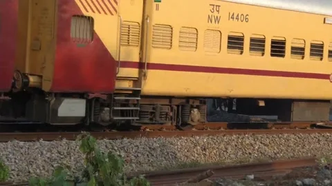 A train is passing from the railway crossing. Stock Footage 145516670
