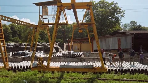 Train passing by the railway sleeper plant. Stock Footage 163356544
