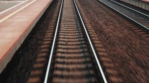 Train Passing By Railway Station Platform with Track Concrete Railroad Ties  Stock Footage 170514264