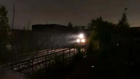 Train passing in the rain Stock Footage 114757881