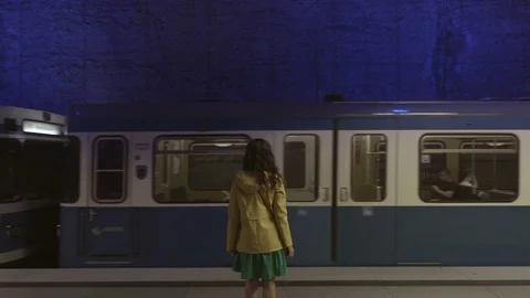 Train passing by the standing on the platform girl Stock Footage 81798930