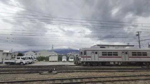 Train Passing a Station Level Crossing Stock Footage 323914061