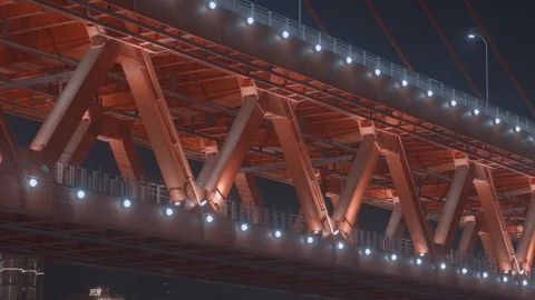 A Train is passing through the bridge at night. 4K. Drone Stock Footage 108862435