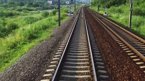 Train passing through countryside hypnotic moving railroad tracks stock footage Stock Footage 68110861