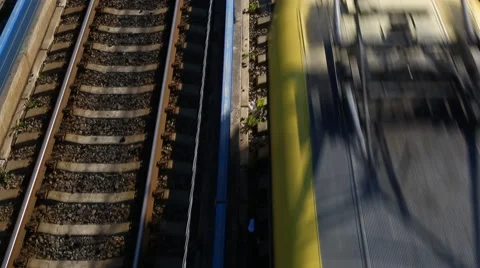 Train passing through countryside, moving railroad tracks Stock Footage 63349423