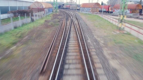 Train passing through countryside, moving railroad tracks Stock Footage 98720926