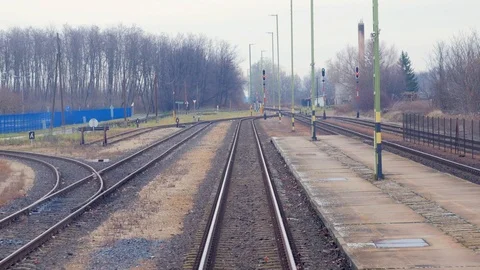Train passing through countryside, moving railroad tracks Stock Footage 98723243
