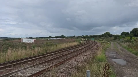 Train passing through gwinear level crossing Video stock 246523515