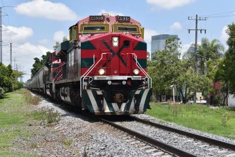 The train passing through Inglaterra avenue, the red locomotive in Guadalajar Stock Photos