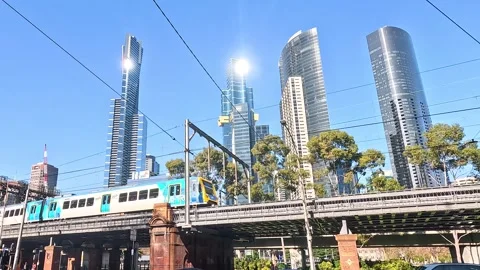 Train Passing Through Melbourne Cityscape Vídeo Stock 296084464