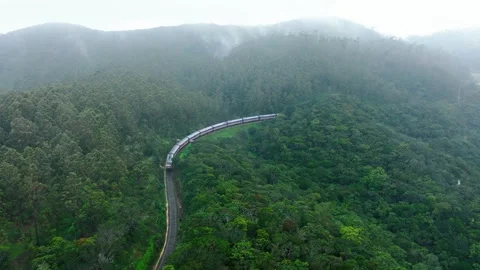 Train Passing Through Misty Mountains in Pattipola Sri Lanka, Color Graded Stock Footage 318309165