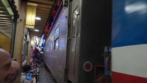 Train Passing Through the Narrow Train Street in Hanoi. Stock Footage 323765010