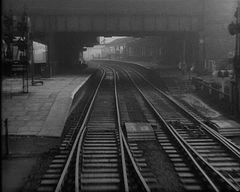 Train passing through railway station, UK 1957 Video stock 132322153