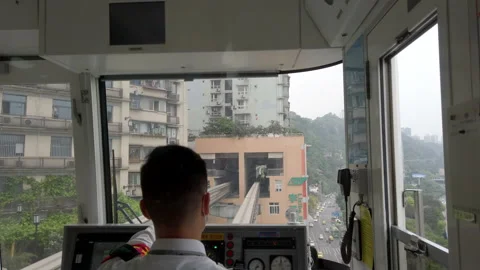 Train passing through residential building, Chongqing, China. Stock Footage 153731668