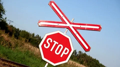 Train is passing through the road with a command standing on road sign. Stock Footage 71218816