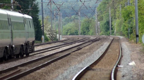 Train passing through rural landscape Stock Footage 38295436