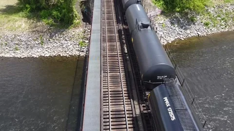 Train Passing Through Steel Bridge Stock Footage
