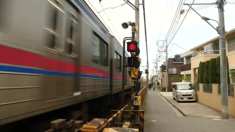 Train passing through suburb in Tokyo, Japan. Stock Footage 249357732