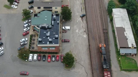 Train passing through town Stock Footage 114751755