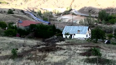 Train passing through the village Stock Footage 43102911