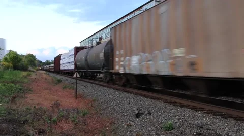 Train Passing Through a Yard (1 of 2) Stock Footage