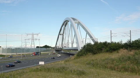 Train passing on the train bridge towards Flevoland Stock Footage 112034605