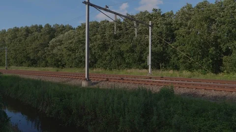 Train is passing by trough nature. 4K footage. Stock Footage 110790517