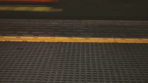 Train passing an underground station Stock Footage 71309641