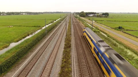 Train passing underneath rising camera, Holland. Stock Footage 67741053
