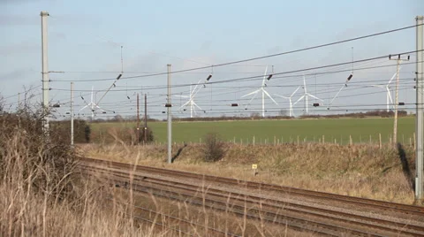 Train passing wind farm Stock Footage 34299727