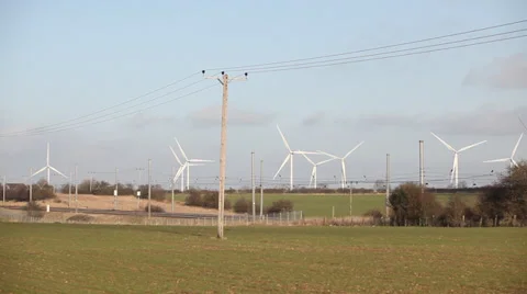 Train passing wind farm Stock Footage 34300292