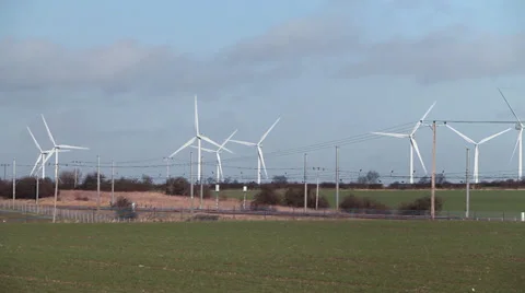 Train passing wind farm Stock Footage 34301957