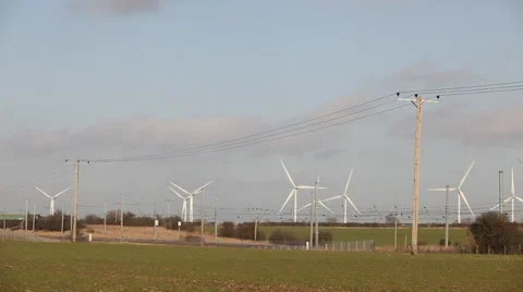 Train passing wind farm Stock Footage 34303221