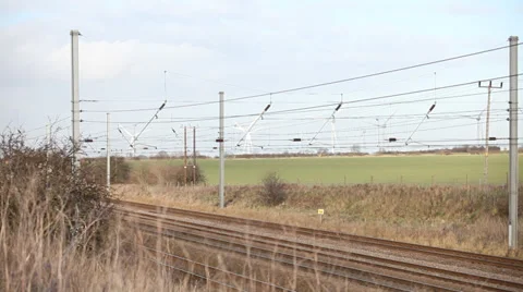 Train passing wind farm Stock Footage 34303554